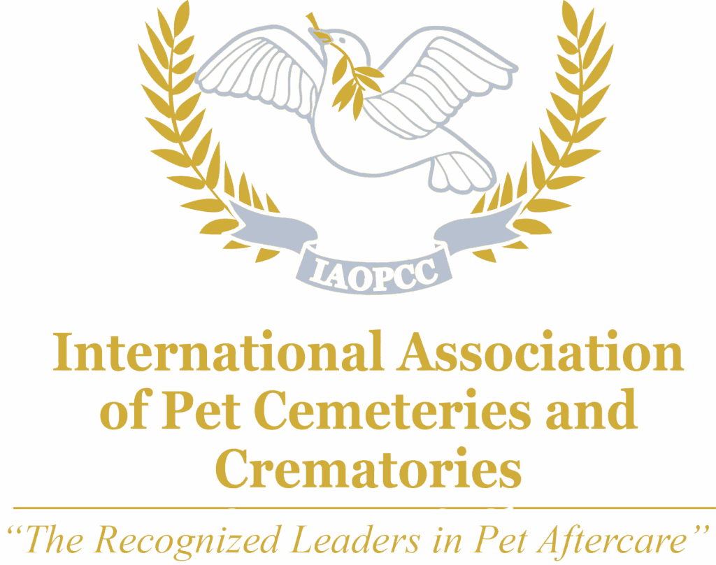 International Association of Pet Cemeteries and Crematories logo featuring a white dove over an open book, framed by a gold laurel wreath.